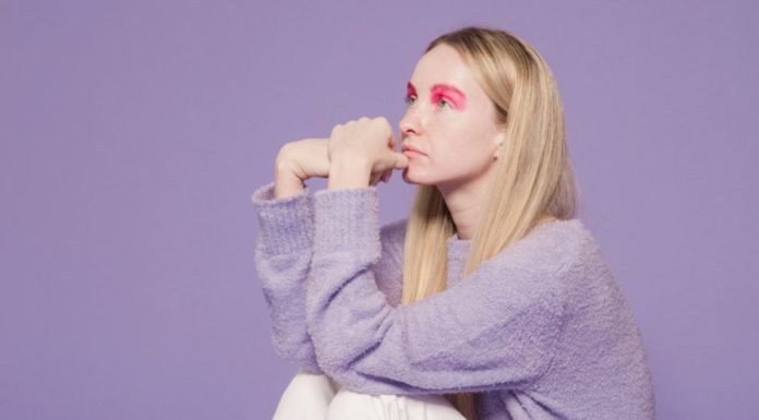 5 Fall Trends to Shop Before Summer Ends Woman wearing a lavender sweater