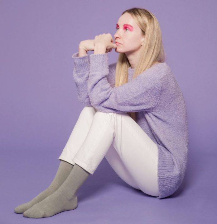 Woman wearing a lavender sweater